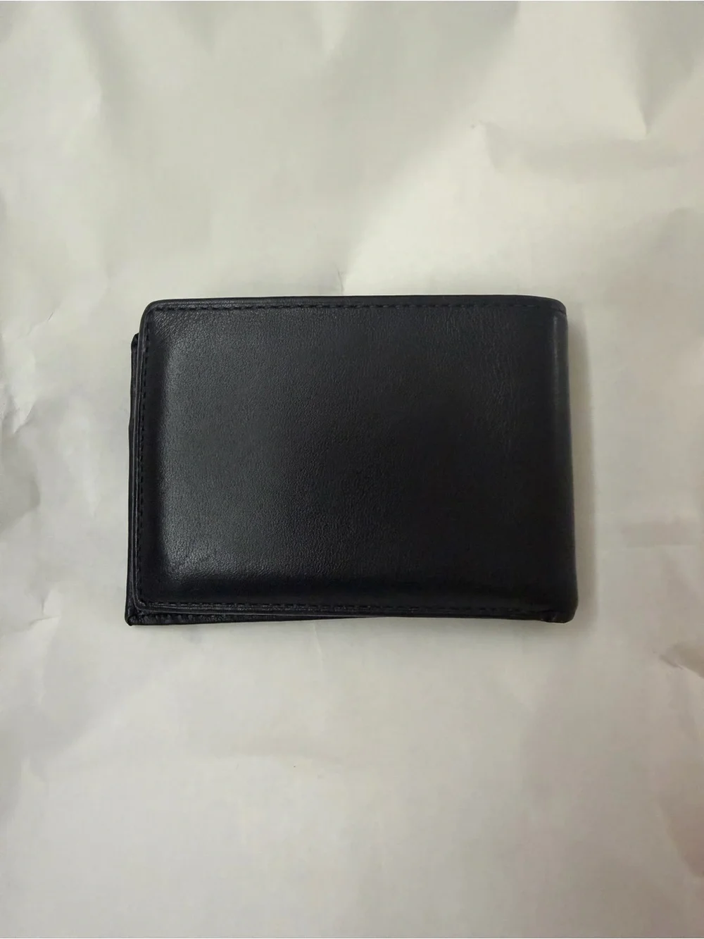 Tumi Black Leather Men's Wallet with Embossed Logo